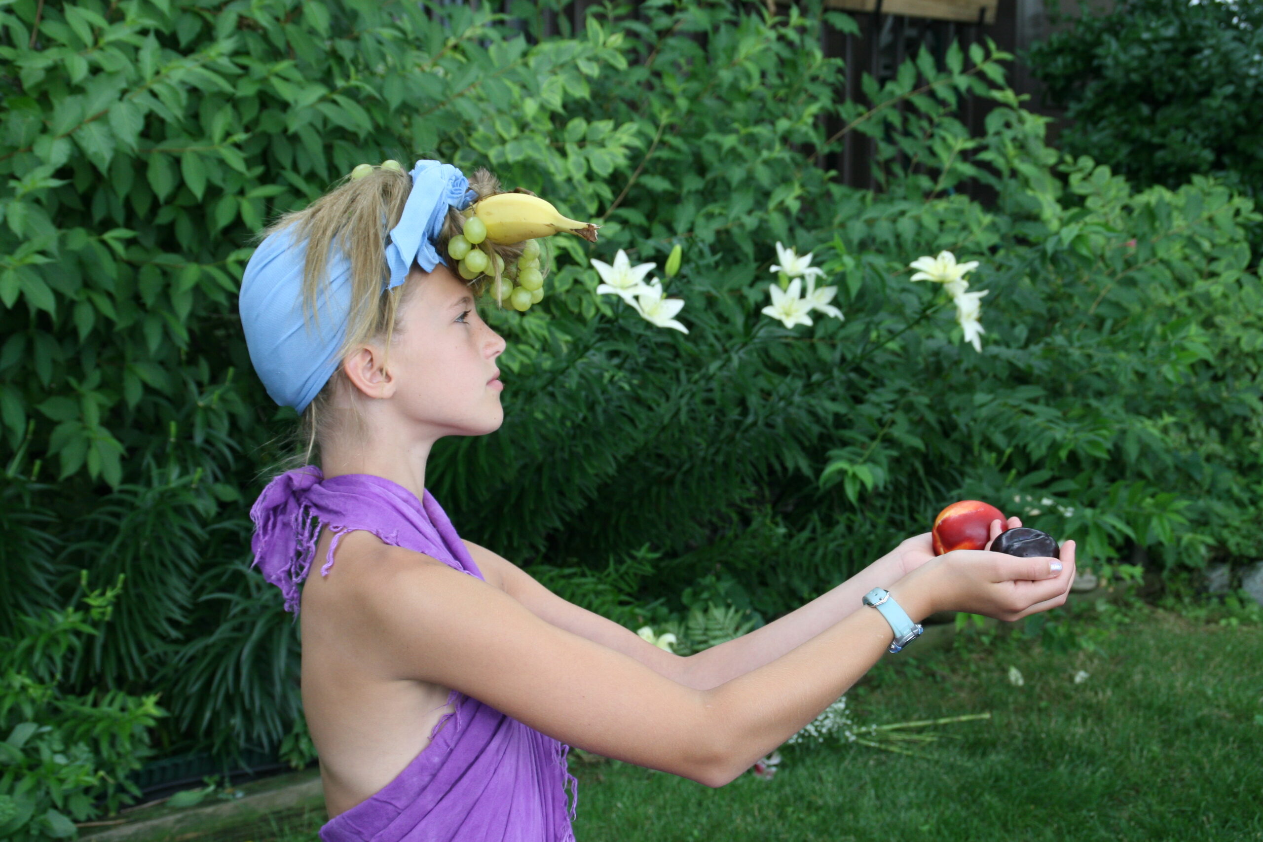 Emma with fruit on her head